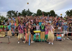 large group of kids dressed in Hawaiian outfits